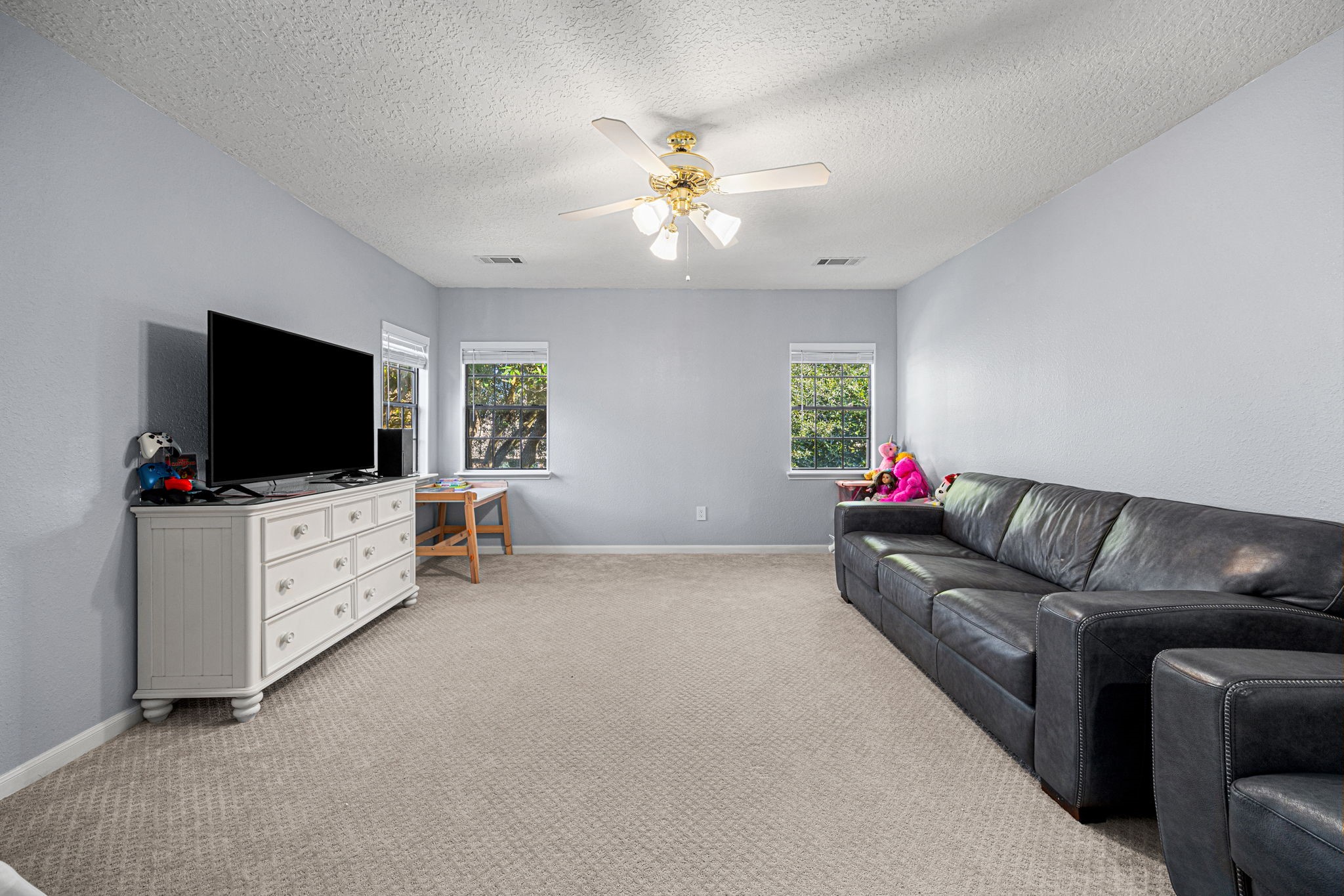 3402 Deeds Road Houston, TX 77084 - Photo 28 of 35 a living room with furniture and a flat screen tv
