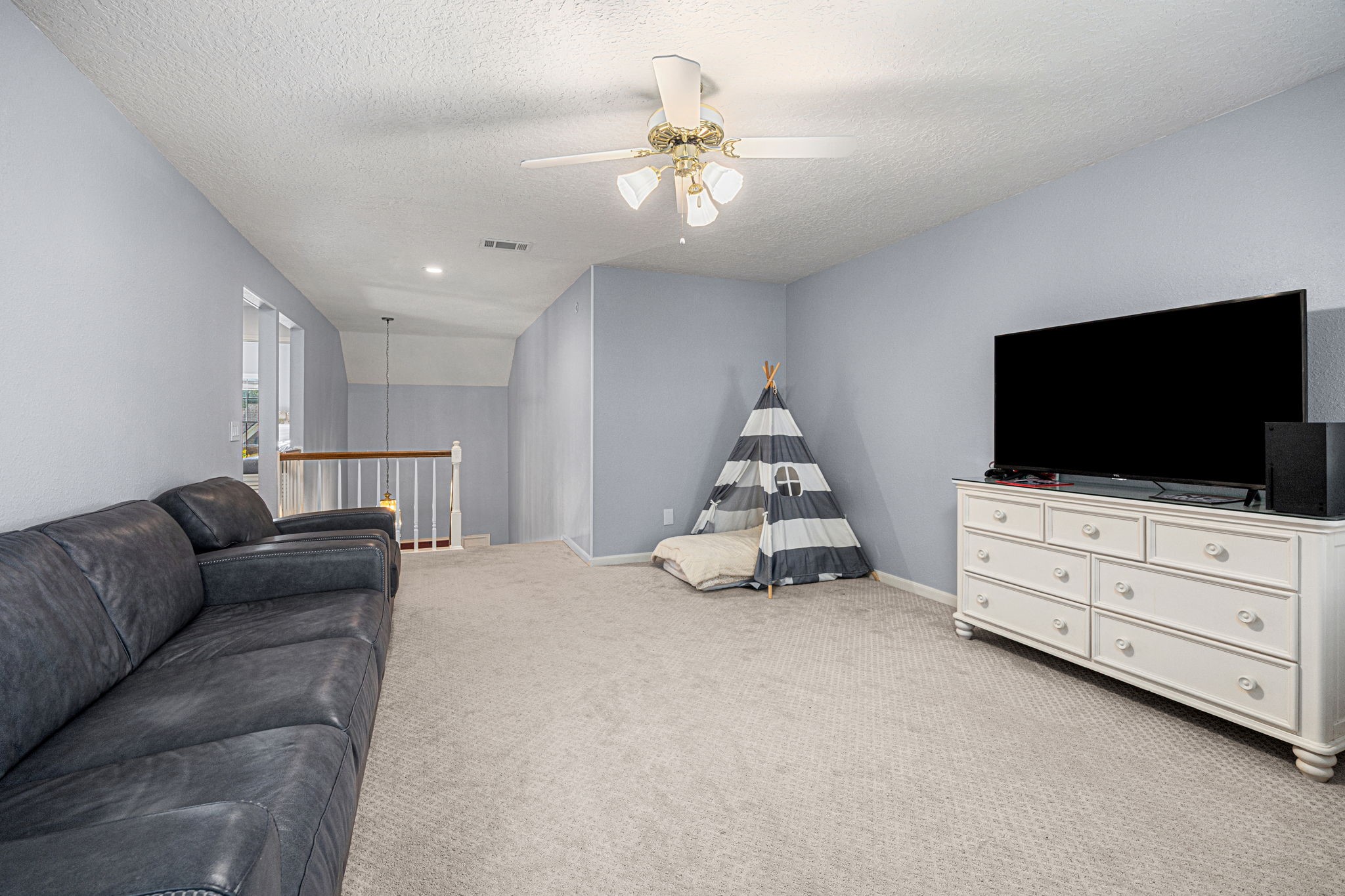 3402 Deeds Road Houston, TX 77084 - Photo 29 of 35 a living room with furniture and a flat screen tv