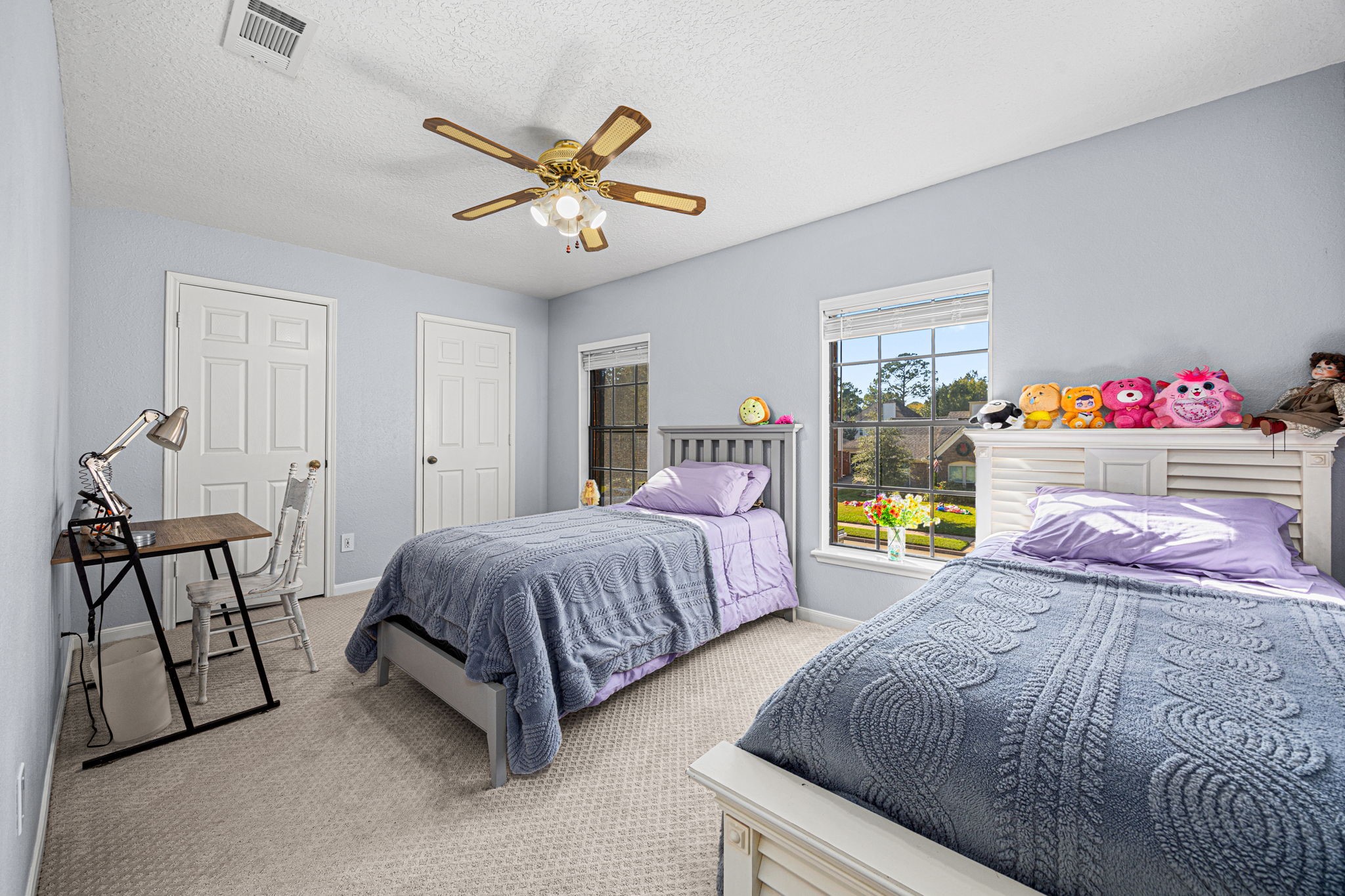 3402 Deeds Road Houston, TX 77084 - Photo 30 of 35 a spacious bedroom with a bed and a chandelier