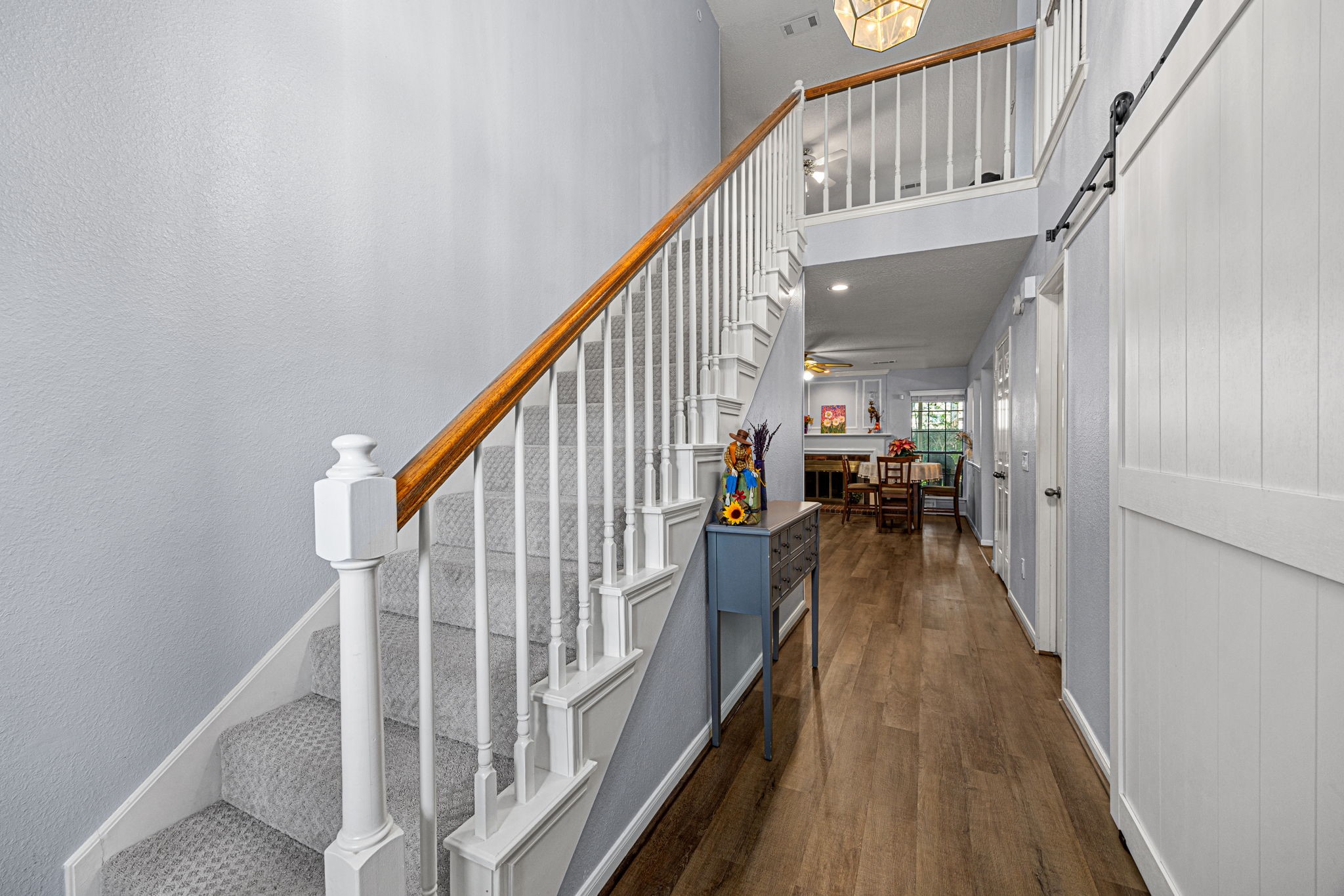 3402 Deeds Road Houston, TX 77084 - Photo 6 of 35 a view of staircase with wooden floor and fan