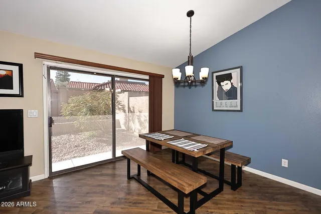 a view of workspace with furniture and a window