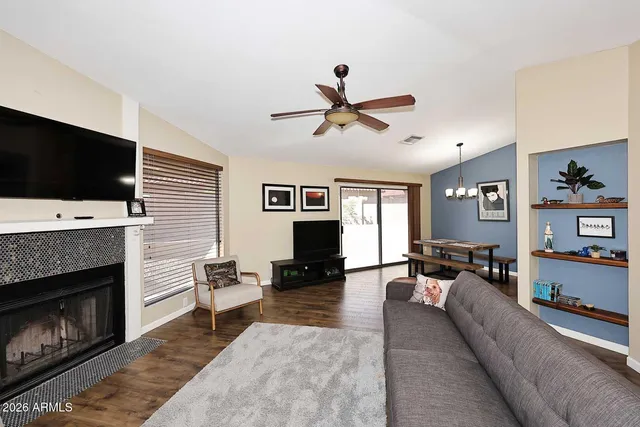 a living room with furniture and a flat screen tv