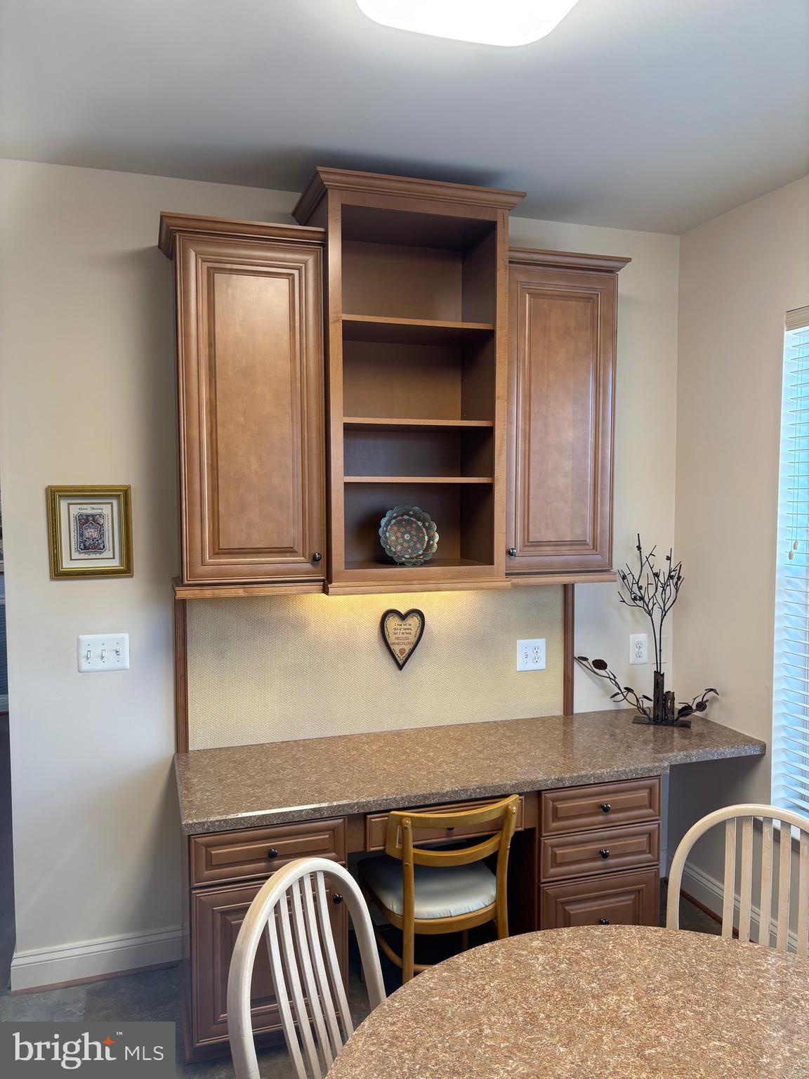 7300 Travertine Drive, Unit 302 Baltimore, MD 21209 - Photo 15 of 30 a view of kitchen island with cabinets and stove