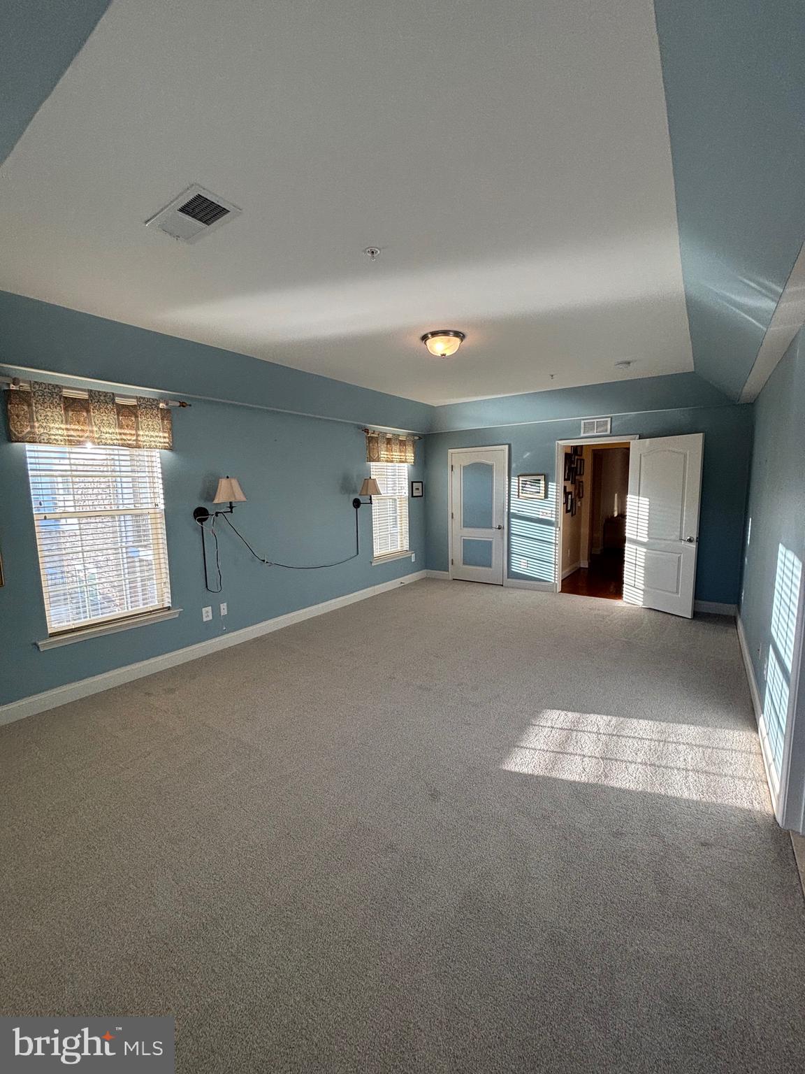 7300 Travertine Drive, Unit 302 Baltimore, MD 21209 - Photo 16 of 30 a view of a livingroom with wooden floor and a fireplace