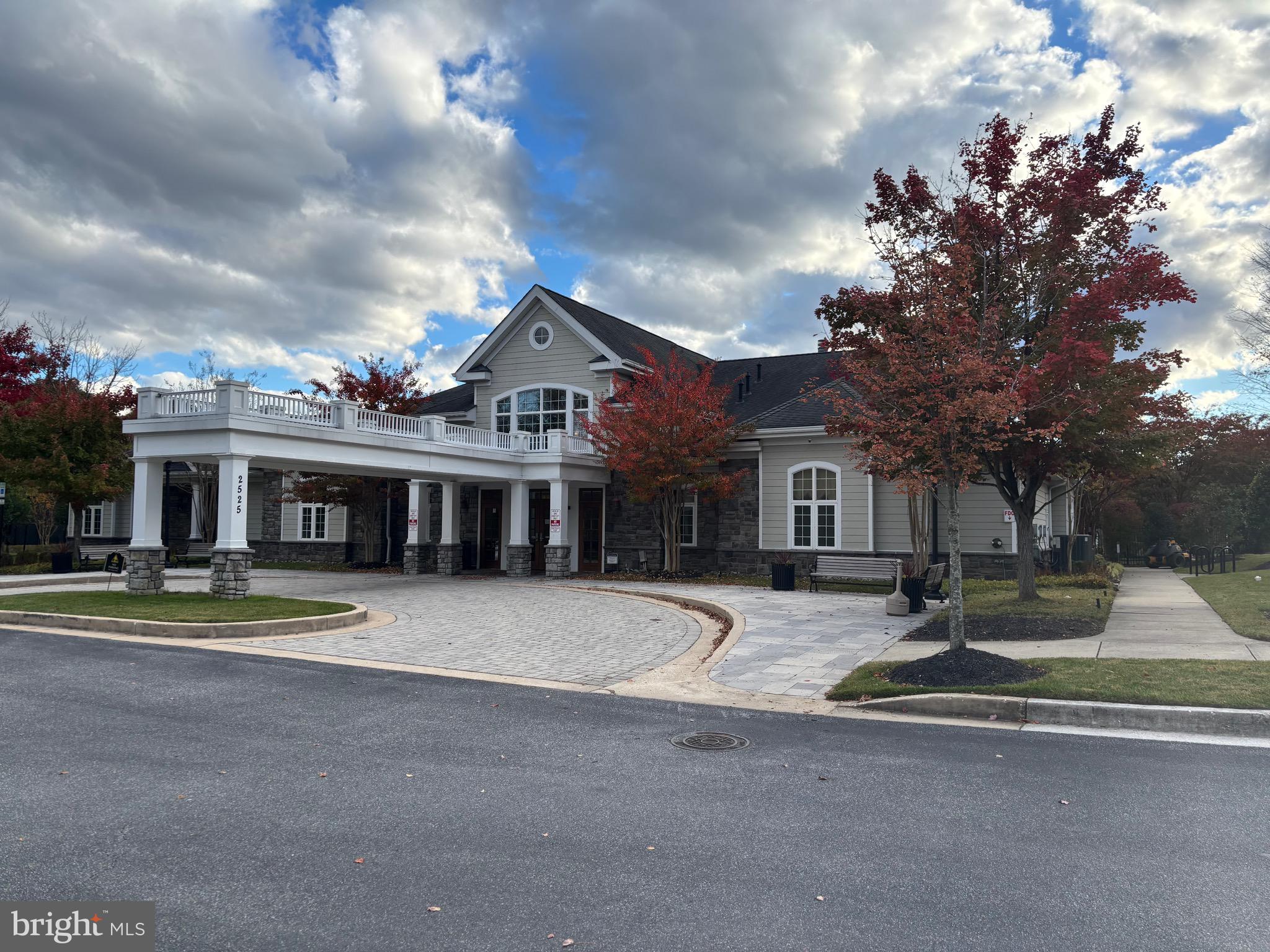 7300 Travertine Drive, Unit 302 Baltimore, MD 21209 - Photo 27 of 30 a front view of a house with a yard
