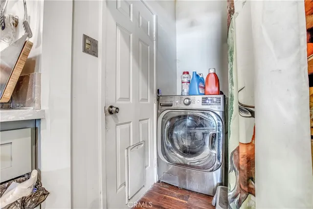 a kitchen with a refrigerator and a stove