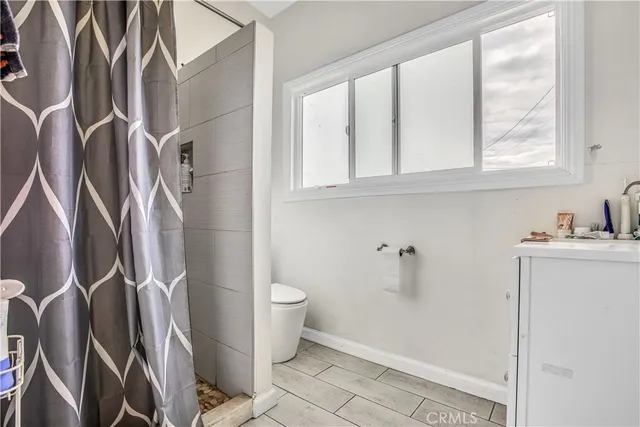 a row of palm trees and a yard