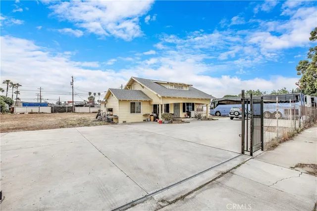 an aerial view of a house with outdoor space