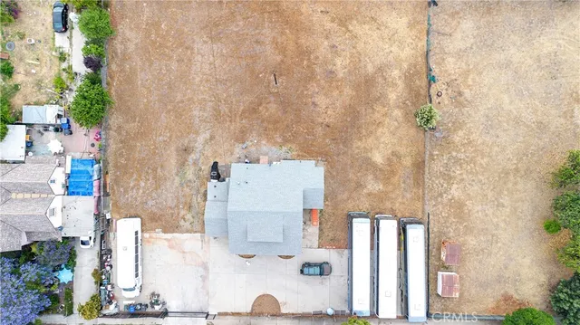 an aerial view of residential building with green space