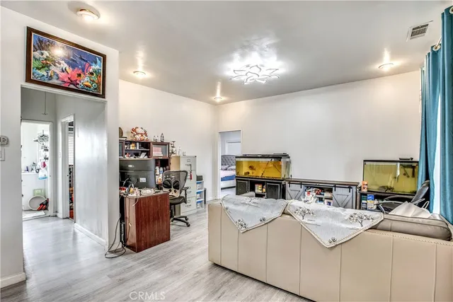 a living room with furniture a fireplace and a table