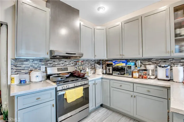 a kitchen with a sink cabinets and window