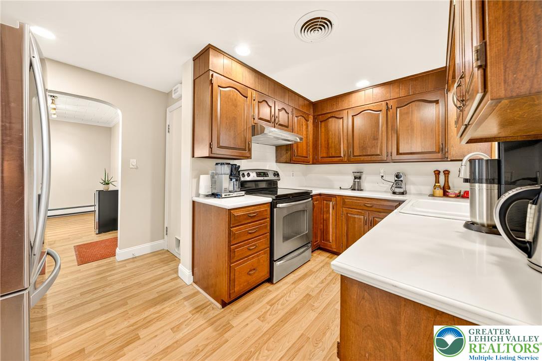 1814 Ruth Street Allentown, PA 18104 - Photo 19 of 47 a kitchen with a stove a refrigerator and a sink