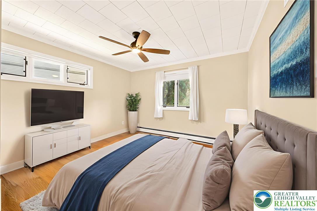 1814 Ruth Street Allentown, PA 18104 - Photo 24 of 47 a bedroom with a large bed and a flat screen tv