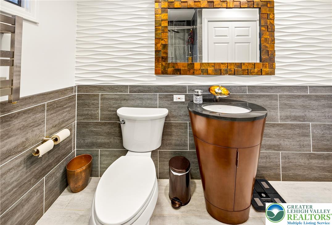1814 Ruth Street Allentown, PA 18104 - Photo 32 of 47 a bathroom with a toilet a sink and a mirror