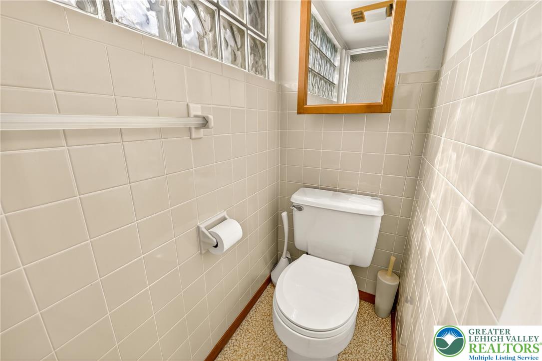 1814 Ruth Street Allentown, PA 18104 - Photo 39 of 47 a white toilet sitting next to a shower curtain