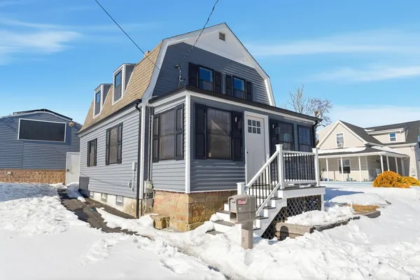 a view of a house with snow on the roof