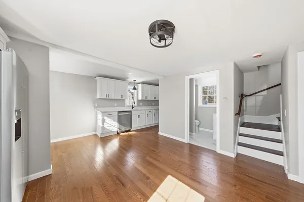 a view of a kitchen cabinets and wooden floor