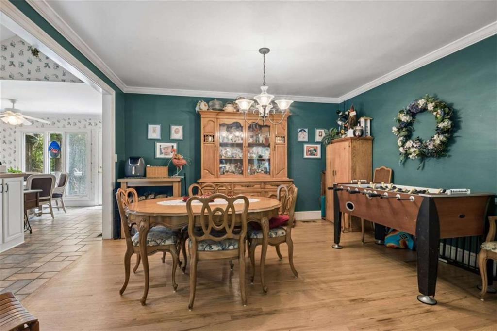 4751 Bill Cheek Road Auburn, GA 30011 - Photo 15 of 82 a view of a dining room with furniture window and wooden floor