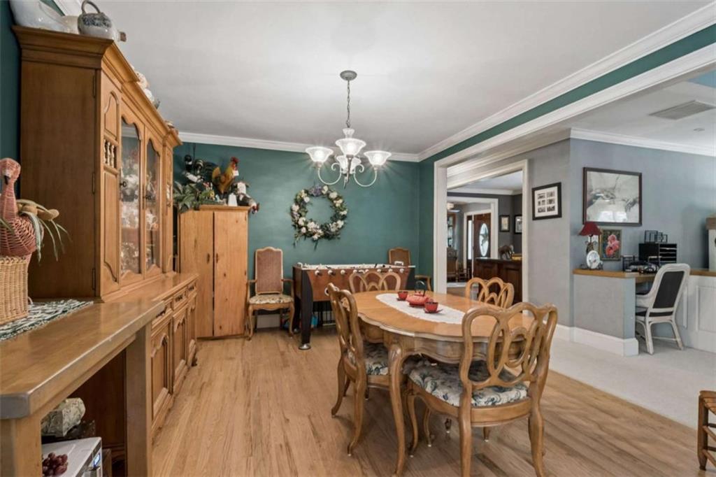 4751 Bill Cheek Road Auburn, GA 30011 - Photo 16 of 82 a view of a dining room with furniture and a chandelier