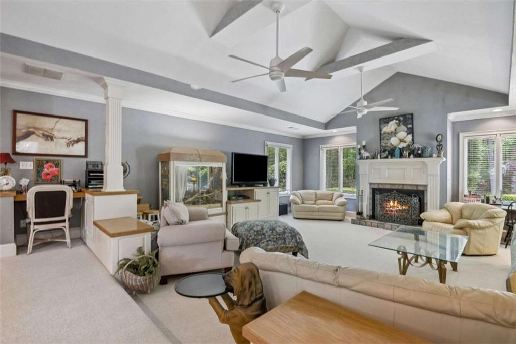 4751 Bill Cheek Road Auburn, GA 30011 - Photo 19 of 82 a living room with furniture fireplace and a large window