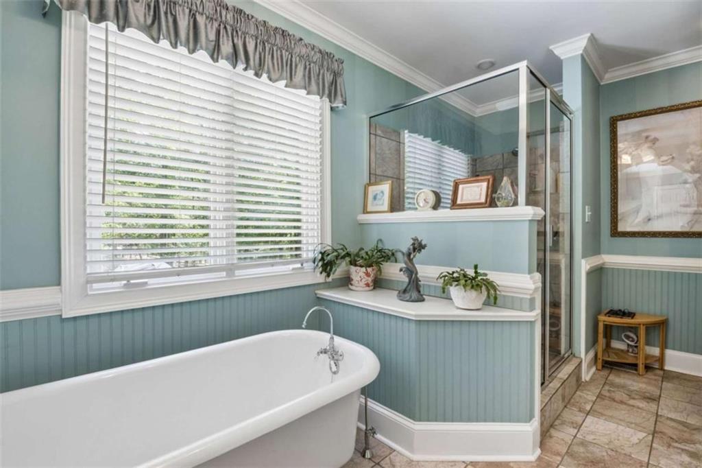 4751 Bill Cheek Road Auburn, GA 30011 - Photo 37 of 82 a bathroom with a sink and a bathtub
