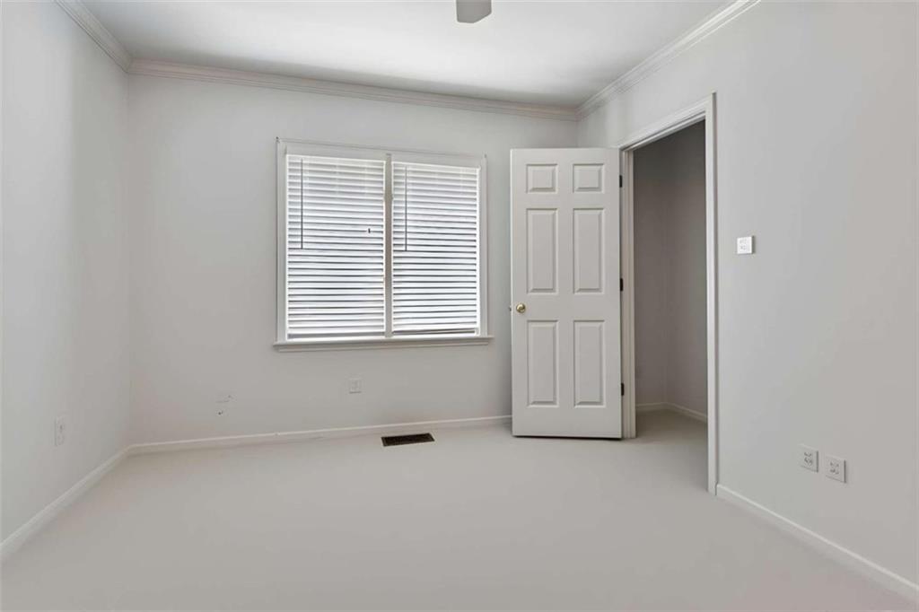 4751 Bill Cheek Road Auburn, GA 30011 - Photo 45 of 82 an empty room with windows and closet