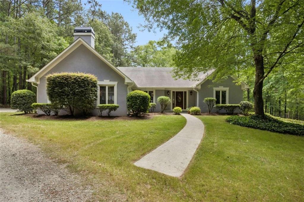 4751 Bill Cheek Road Auburn, GA 30011 - Photo 5 of 82 a front view of a house with garden