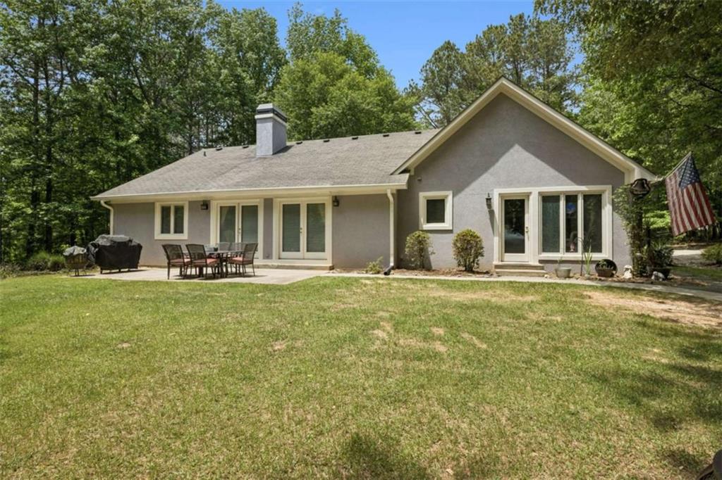 4751 Bill Cheek Road Auburn, GA 30011 - Photo 51 of 82 a front view of a house with a yard