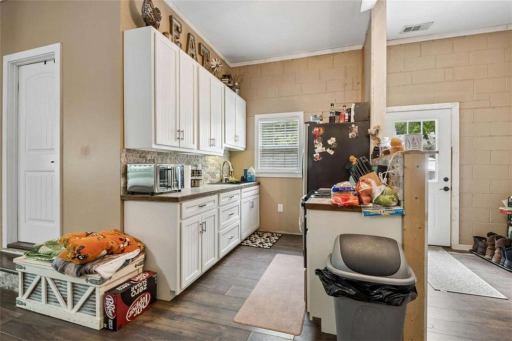 4751 Bill Cheek Road Auburn, GA 30011 - Photo 59 of 82 a kitchen with a refrigerator and a stove top oven