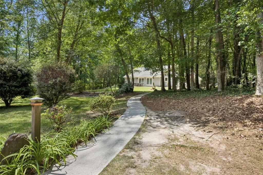 4751 Bill Cheek Road Auburn, GA 30011 - Photo 81 of 82 a view of a yard with plants and trees