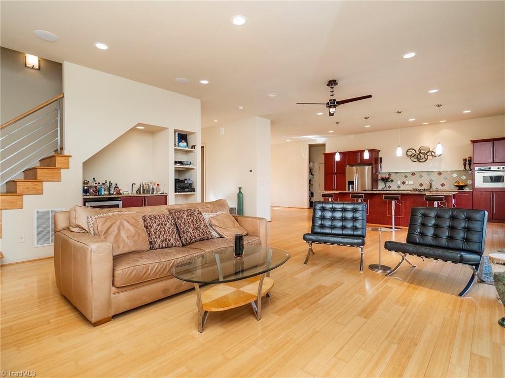 725 Hudson Road Summerfield, NC 27358 - Photo 11 of 36 Living room with access to 2nd level, views of the wet bar.