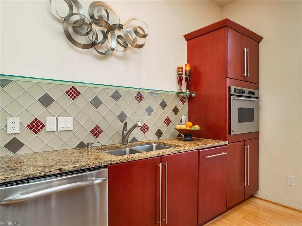 725 Hudson Road Summerfield, NC 27358 - Photo 13 of 36 Granite counter tops with all stainless steel appliances.
