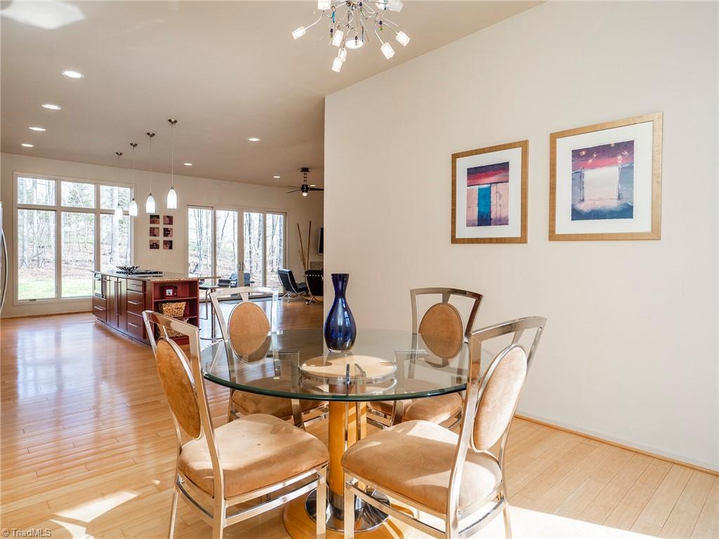725 Hudson Road Summerfield, NC 27358 - Photo 15 of 36 Dining area with bamboo floors, open to kitchen and living room with great natural light.