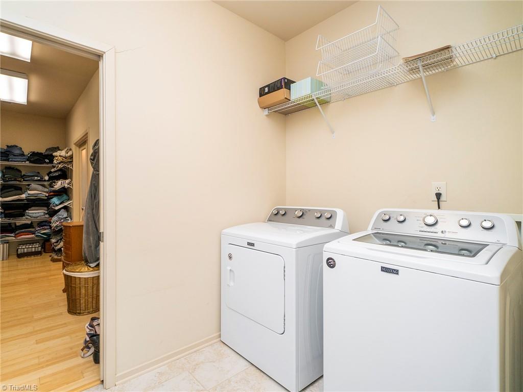 725 Hudson Road Summerfield, NC 27358 - Photo 21 of 36 Laundry room connects to owner suite closet.