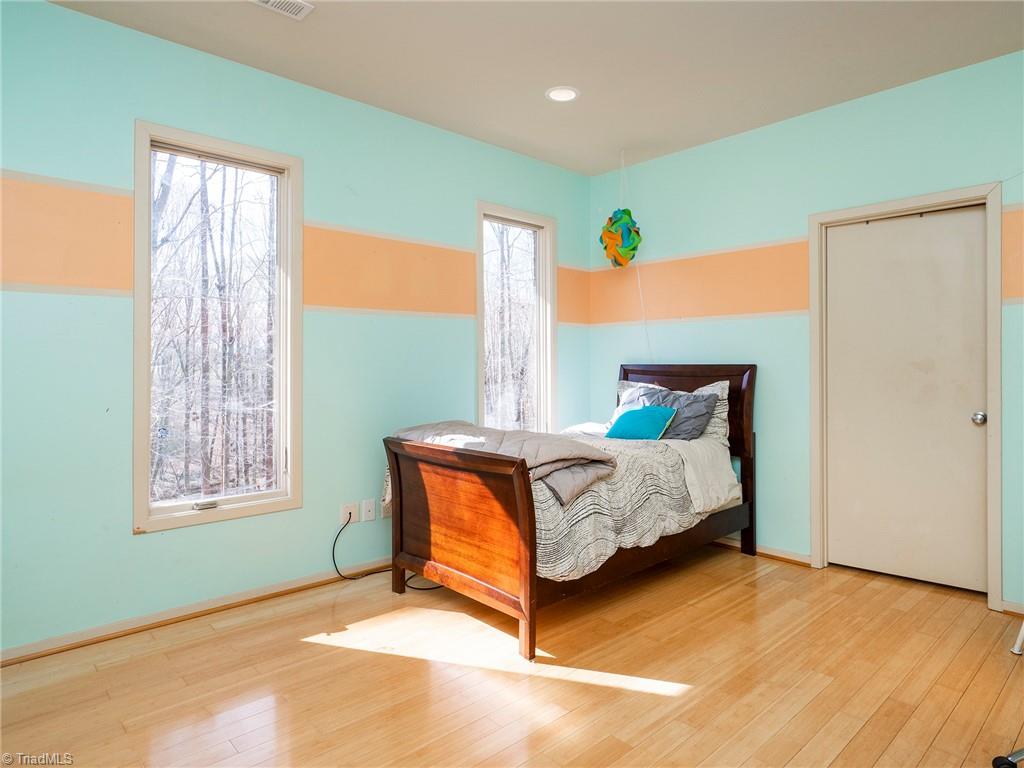 725 Hudson Road Summerfield, NC 27358 - Photo 23 of 36 2nd bedroom with large closet and views of the front yard.