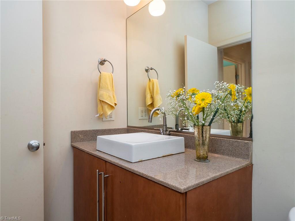725 Hudson Road Summerfield, NC 27358 - Photo 24 of 36 Hall bath with single bowl vanity and great space.