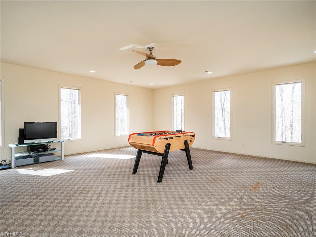 725 Hudson Road Summerfield, NC 27358 - Photo 26 of 36 Huge Bonus room with tons of windows and natural light!