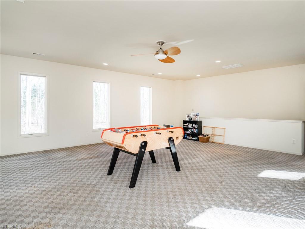 725 Hudson Road Summerfield, NC 27358 - Photo 27 of 36 Huge bonus room with private stairs to kitchen.