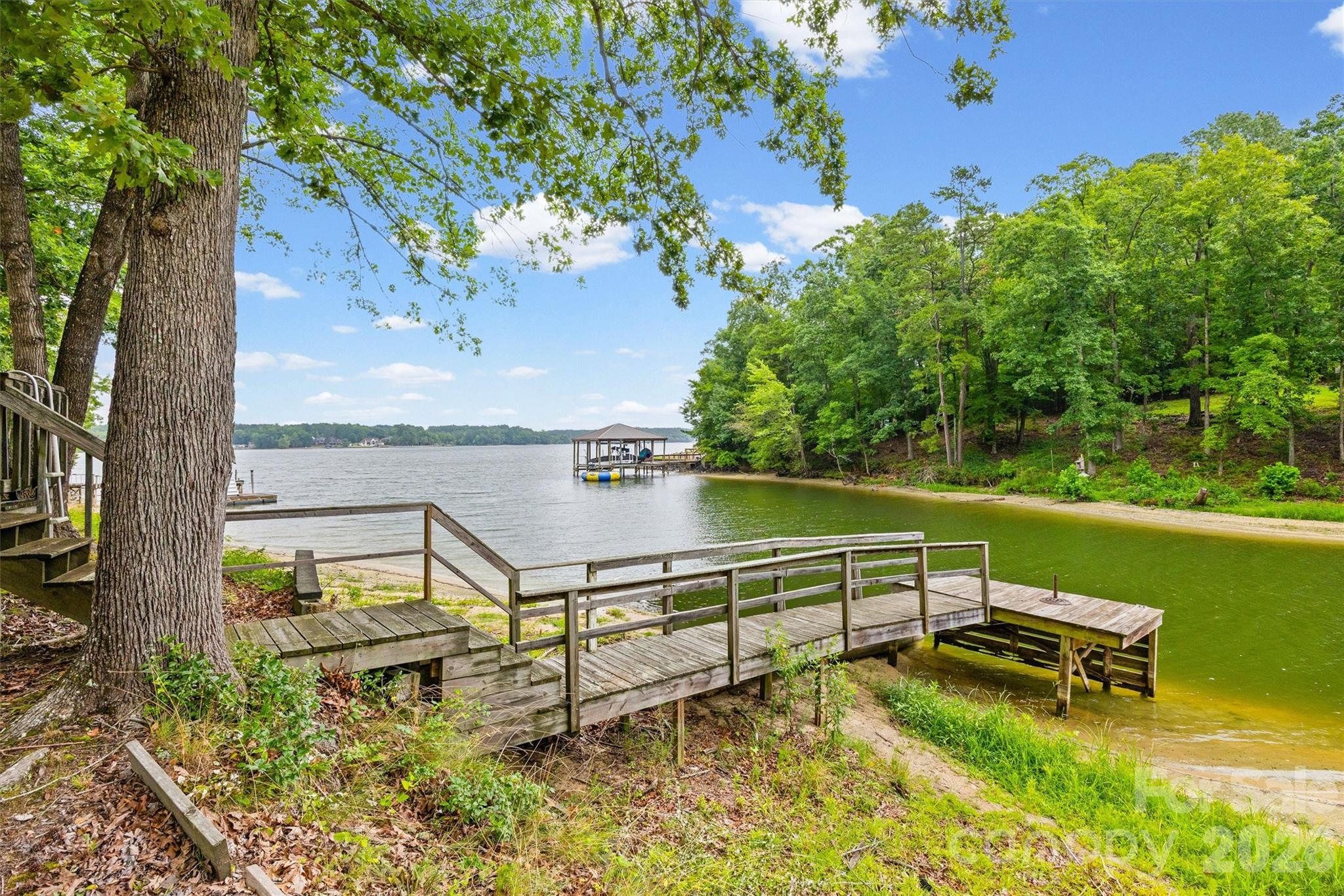 2071 Chameleon Road, Unit 156 York, SC 29745 - Photo 30 of 46 a bench sitting in the middle of a lake