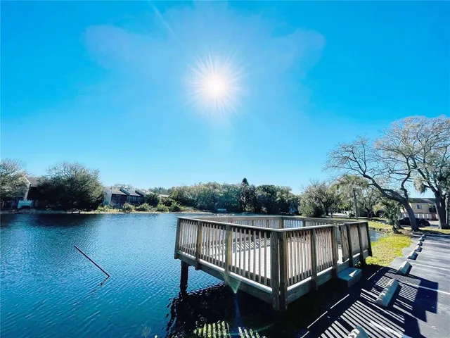 a view of a lake with a big yard