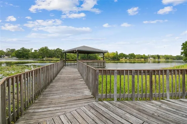 a view of a lake with houses in the back