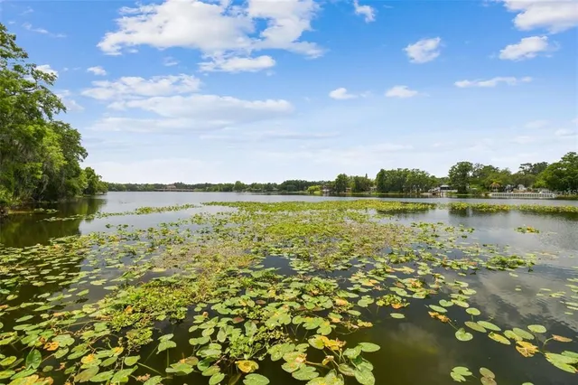 a view of lake with house in background