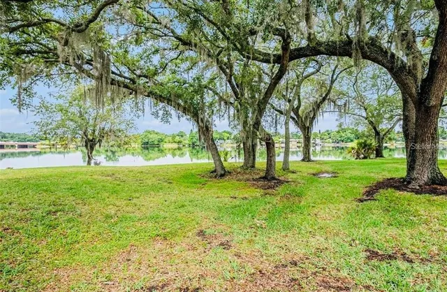 a view of a wooden deck next to a yard