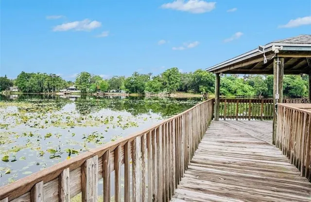 an aerial view of a houses with a lake view