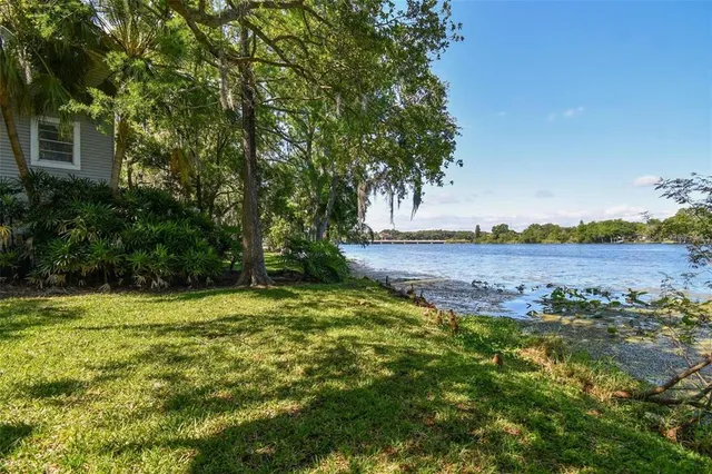 a view of a balcony with wooden floor and fence