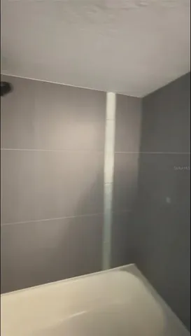 a room with gym equipment and appliances