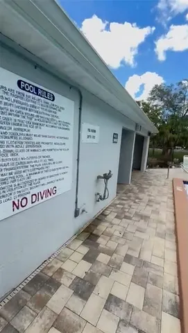 a small pool is sitting in the middle of a yard