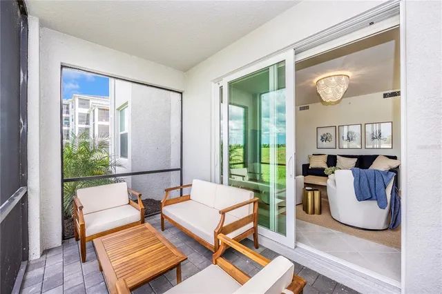 a swimming pool with outdoor seating and yard