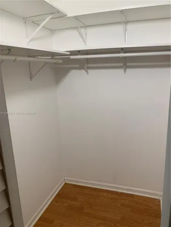 a bathroom with a double vanity sink and mirror
