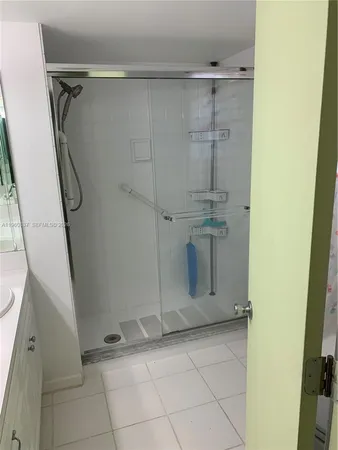 a view of an empty room with a mirror